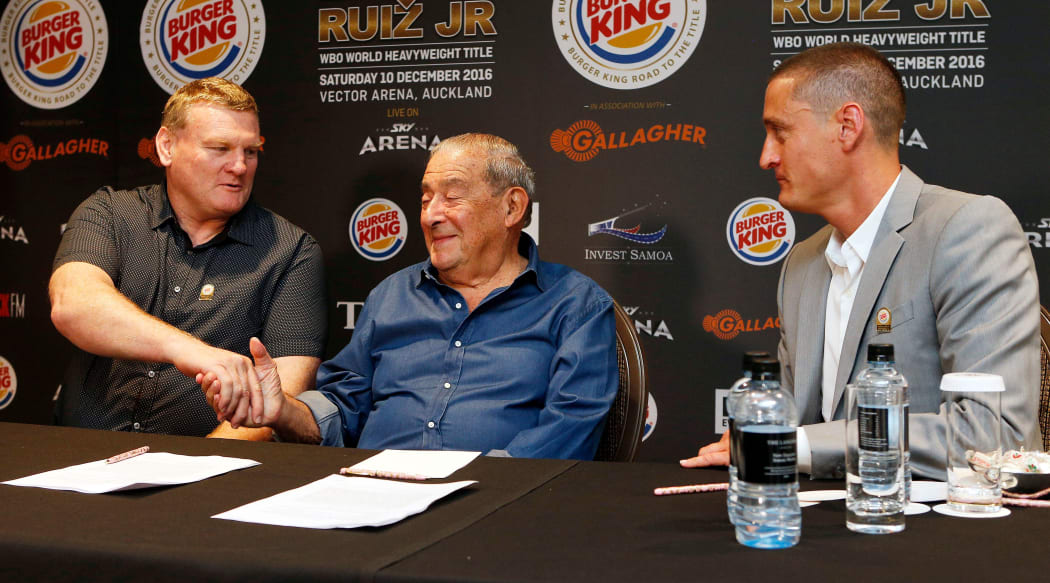 Duco co-director Dean Lonergan (L) shakes hand's with Top Rank CEO Bob Arum (C) along with Duco co-director David Higgins.