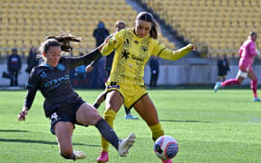 Phoenix midfielder Macey Fraser challenges for the ball against Melbourne City.