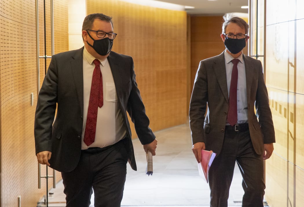 Deputy Prime Minister Grant Robertson and Director General of Health Dr Ashley Bloomfield arriving for the Covid-19 response and vaccine update at Parliament, Wellington.  24 August, 2021  NZ Herald photograph by Mark Mitchell
