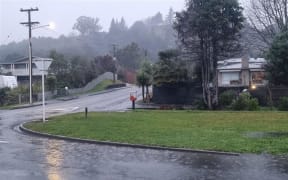 Water pooling on Eighty Eight Valley Road in Wakefield as rain arrives in the Nelson-Tasman region.