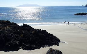 Beach and sea with distant island