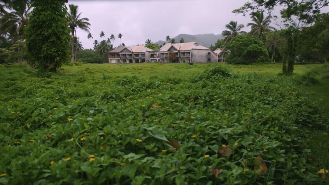 The Sheraton Hotel in its current overgrown and derelict state