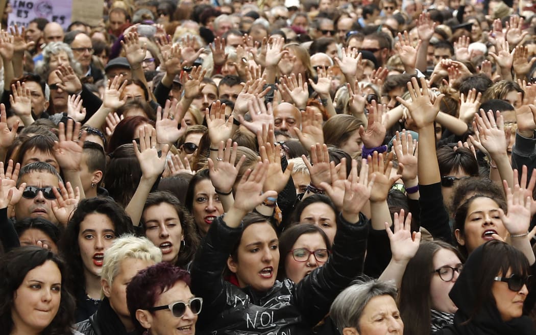 People shout slogans during a protest in Pamplona on April 28, 2018