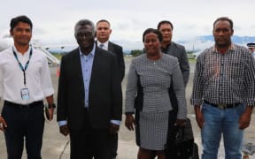 Solomon Islands prime minister Manasseh Sogavare (second from left) and his wife, Madam Emmy, along with officials, prepare to depart to New York for a UN meeting.