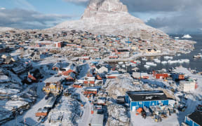 Uummannaq Mountain towers above a town of the same name and its iceberg-filled fjord in Greenland, another destination on the list. Photo: Ciril Jazbec