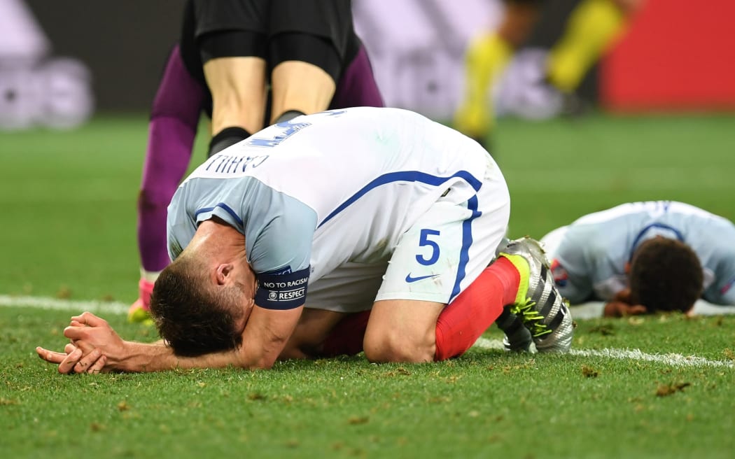 England's defender Gary Cahill reacts to the knock-out defeat.