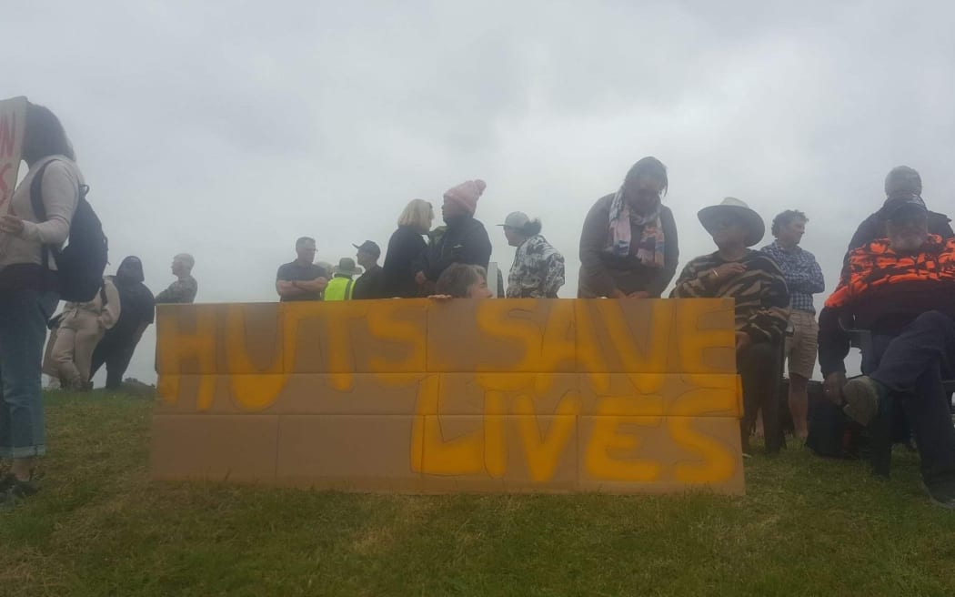 About 200 people gathered in Tāneatua to protest the removal of Te Urewera Department of Conservation backcountry huts.