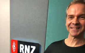 RNZ's Auckland Operations team leaders Jeremy Ansell shows off the pencil-case that made in Home Economics class.