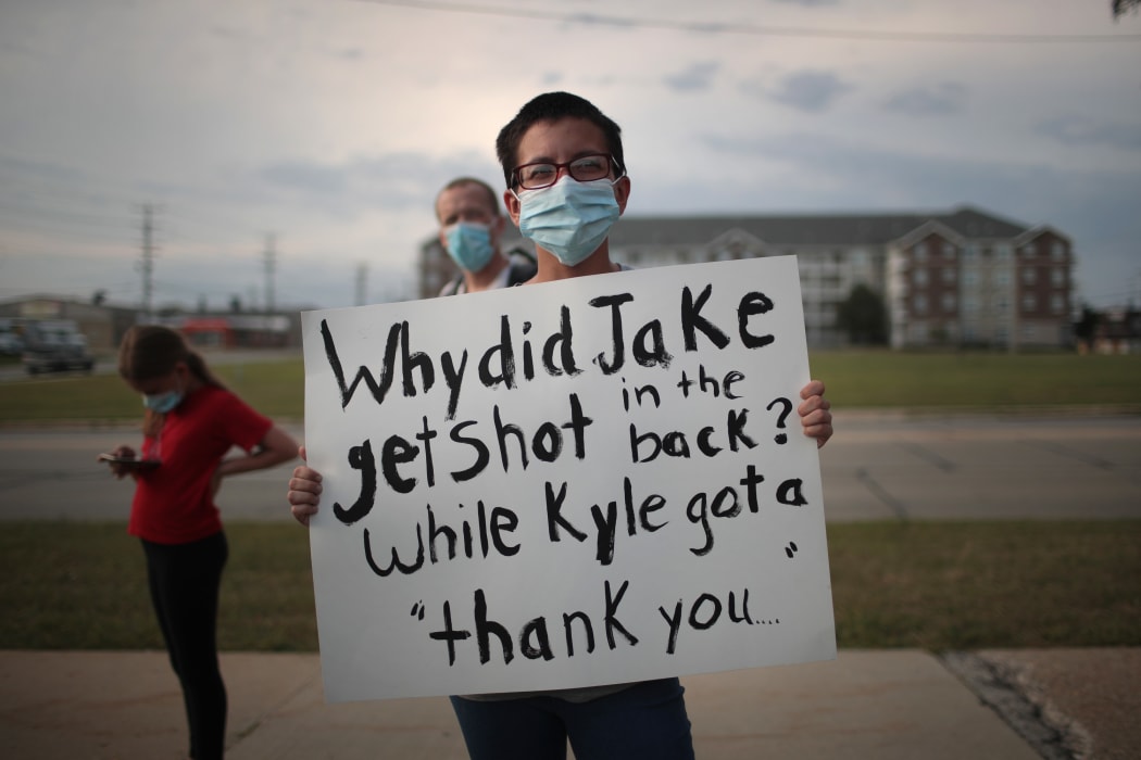 A small group of peaceful demonstrators protesting the shooting of Jacob Blake hold a rally on August 28, 2020 in Kenosha, Wisconsin.