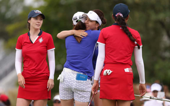Georgia Hall of Team Europe and Leona Maguire of Team Europe hug after winning their match over Yealimi Noh of Team USA and Brittany Altomare of Team USA during the Foursomes Match on day one of the Solheim Cup at the Inverness Club on September 04, 2021 in Toledo, Ohio.