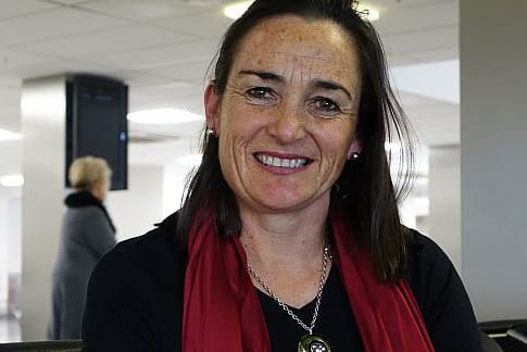 Agri consultant Alison Dewes sits at Auckland domestic airport
