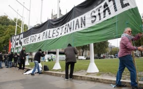 Pro-Palestinian supporters in Parliament Square, central London, yesterday.