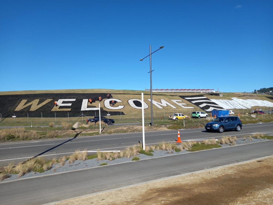 Workers were forming Wellington Airport's 'welcome' sign on Sunday