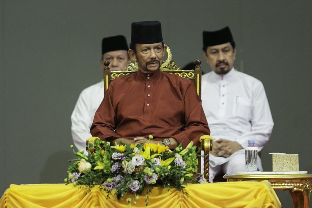 Brunei's Sultan Hassanal Bolkiah (C) attends an event in Bandar Seri Begawan on April 3, 2019.