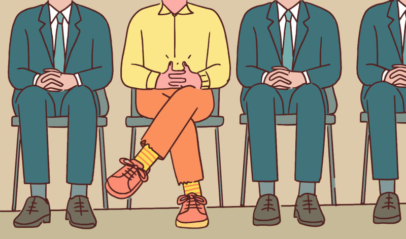 An illustration of several people sitting down in suits with one in the middle wearing bright-coloured clothing.