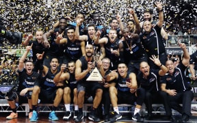 The Breakers celebrate with the ANBL trophy after winning the finals series 2-0 against the Taipans.
