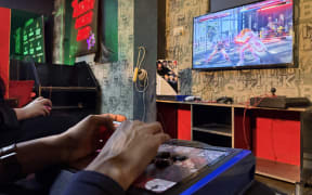 Gamers compete in "Tekken" at the Maniax arcade in Lahore, Pakistan.
