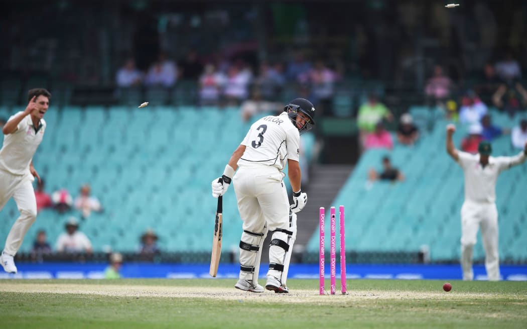 Ross Taylor is bowled by Pat Cummins.