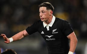 Cam Roigard playing against France.