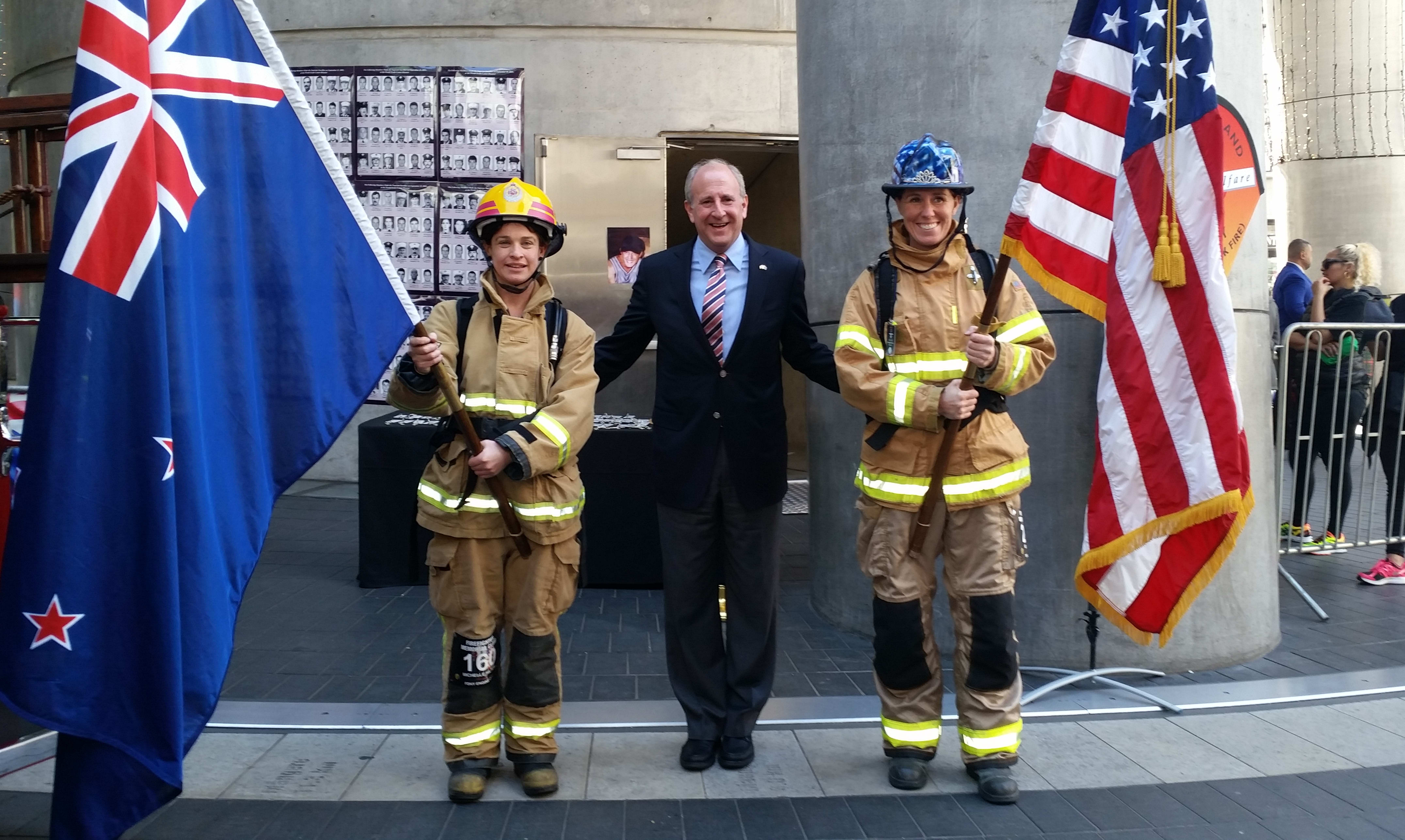 US Ambassador Mark Gilbert with flag bearers before the Sky Tower 9/11 memorial climb/