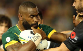 Australia's Semi Radradra takes on New Zealand's Jesse Bromwich.