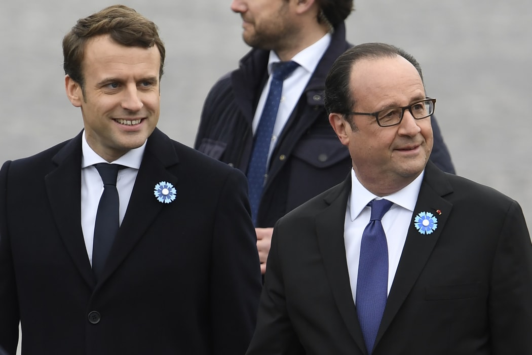 Outgoing French President Francois Hollande (R) and French president-elect Emmanuel Macron arrive to attend a ceremony marking the 72nd anniversary of the victory over Nazi Germany during World War II.