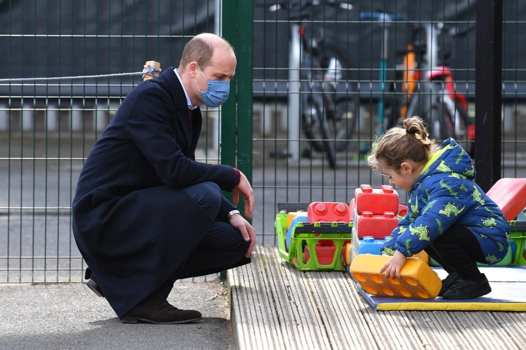 Britain's Prince William, Duke of Cambridge watches as a child plays during a visit to School21 following its re-opening after the easing of coronavirus lockdown restrictions in east London on March 11, 2021.