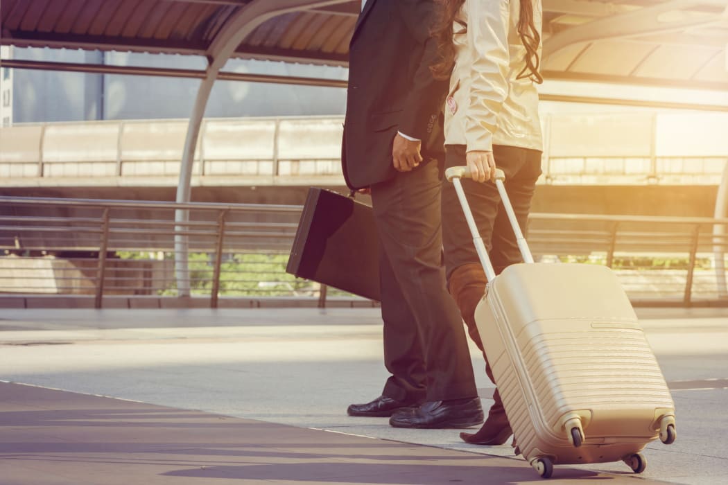 Businessman and businesswoman traveler with luggage at city background, Business People Commuter Walking City Life Concept.
