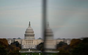 The dome of the US Capitol is reflected in a window as people visit the Washington Monument on November 2.
Mandatory Credit:	Kent Nishimura/Reuters via CNN Newsource