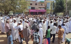Sudanese chant slogans in support of the Army in Gadaref city in war-torn Sudan on December 29, 2023. Fighting between the Sudanese army and paramilitaries engulfed the aid hub of Wad Madani on December 15, triggering an exodus of civilians already displaced by eight months of war, an AFP correspondent reported.