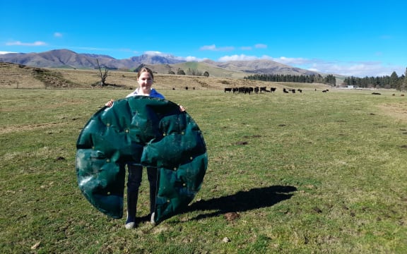 Amy Hay holds a FrostEase Flexi-Mat