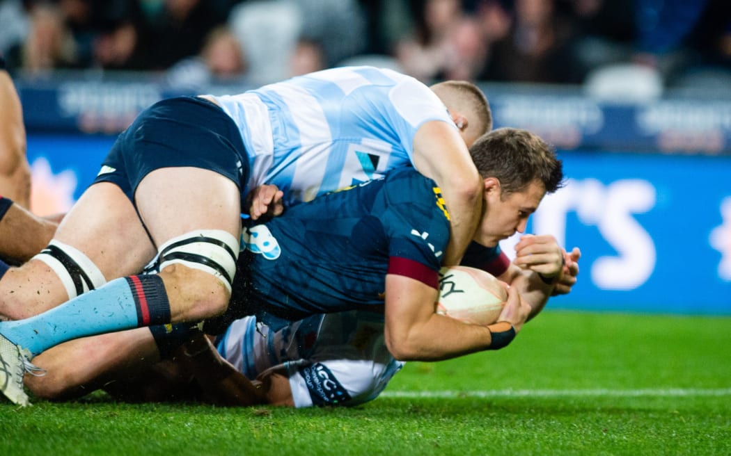 Fullback Michael Collins opens the scoring for the Highlanders