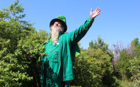 Noel Peterson in his garden, embracing the sun and welcoming its warmth.