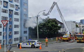 Smoke billows from the single apartment fire in the Pukehinau flats.