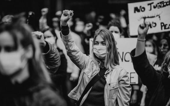 A woman holds up her fist at the Black Lives Matter protest held in Melbourne on Saturday 6 June 2020.