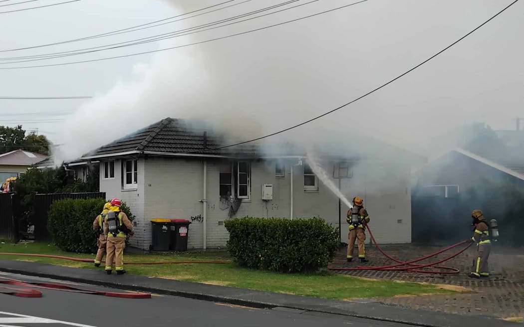 Firefighters battle a house fire in Takapuna, Auckland on 27 January, 2024.