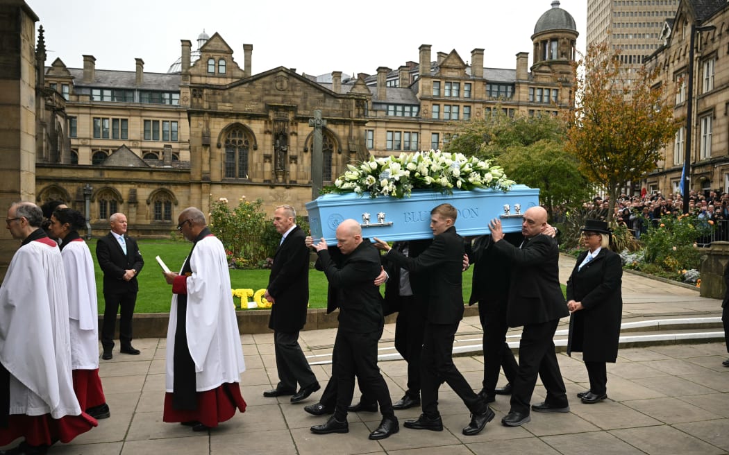 Pall-bearers carry the coffin during the funeral of late British boxer Ricky Hatton.