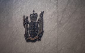 Detail of the wall behind the judge in a court room at the Manukau District Court.