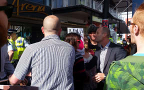 Protestors and an attendee face off in Wellington.