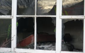 The fire-damaged Palmerston North house where two people died.