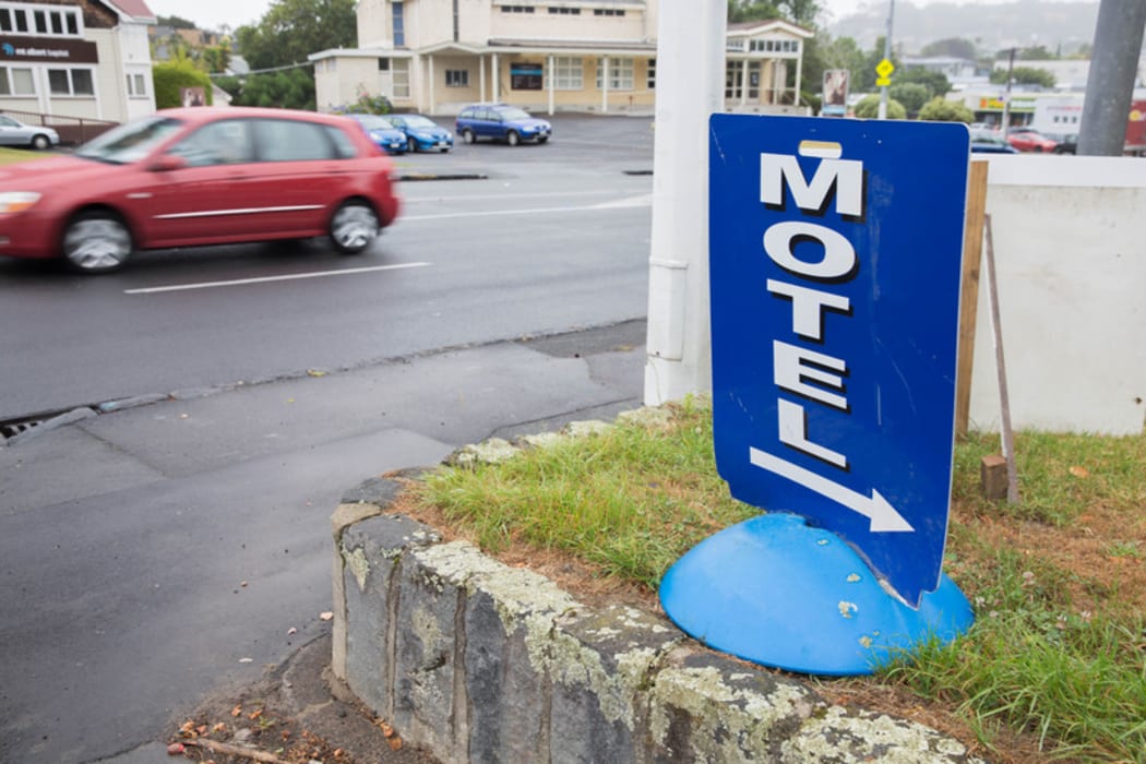 A sign advertising a local motel in Auckland