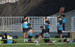 New Zealand's cricketers warm up during a practice session at the Rawalpindi Cricket Stadium in Rawalpindi on September 14, 2021, ahead of their first one-day international (ODI) cricket match against Pakistan. (Photo by Farooq NAEEM / AFP)