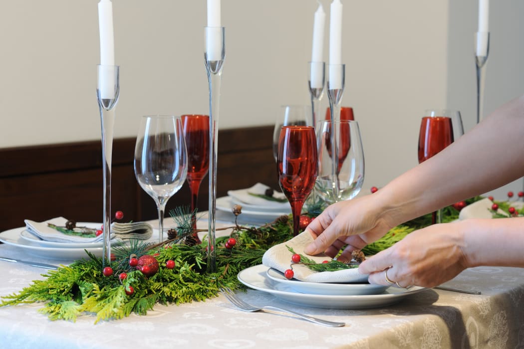 Setting up the table for Christmas dinner.