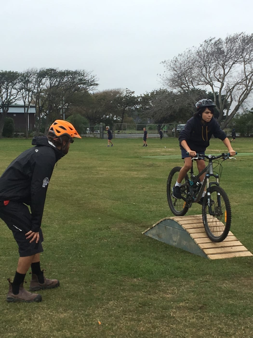 Adventure Park staff teaching kids bike riding skills