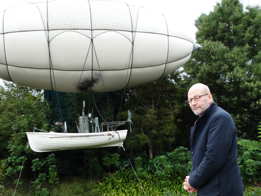 Hamilton Gardens director Peter Sergel and the floating steampunk balloon boat