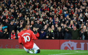 Fans cheer as Marcus Rashford of Man Utd