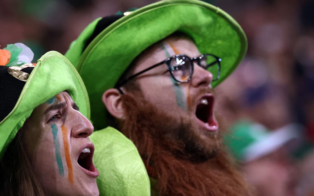 Irish supporters cheer ahead of the France 2023 Rugby World Cup quarter-final match between Ireland and New Zealand at the Stade de France in Saint-Denis, on the outskirts of Paris, on October 14, 2023.