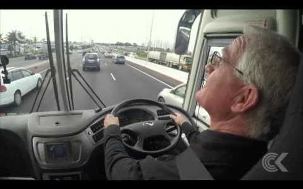 Auckland mayoral candidates take bus ride with John Campbell