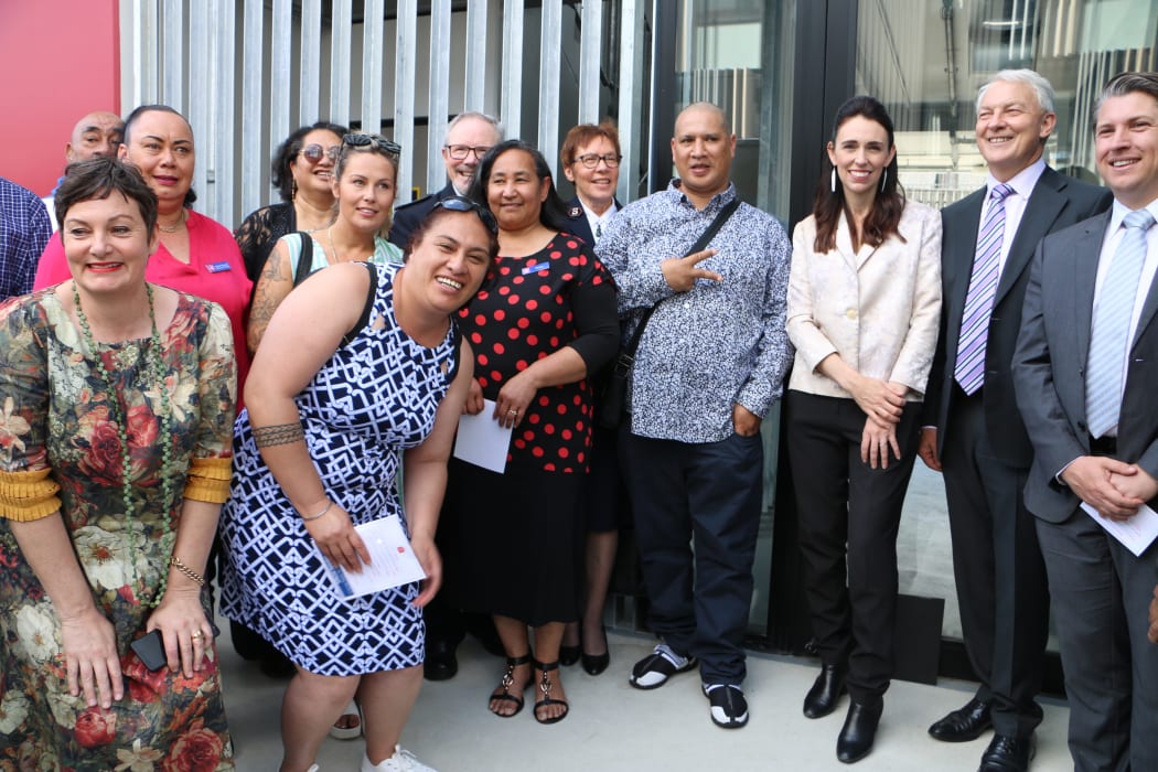 Prime Minister Jacinda Ardern and stakeholders outside the Royal Oak Housing Community.