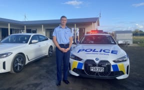 Police electric vehicle  - BMW i4 - and Andrew Coster